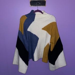 Cream coloured balloon sleeve turtle neck